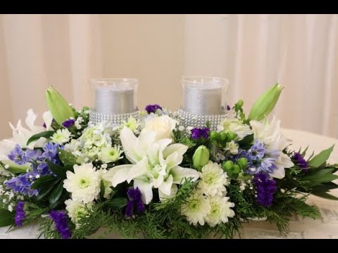 centros de mesa con vela y flores